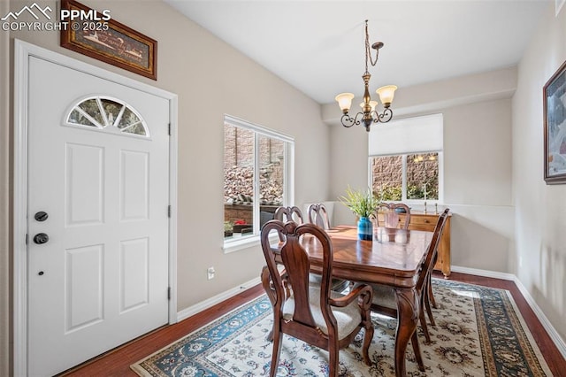 6678 Bethesda Pt Unit C, Colorado Springs, CO 80918 - dining room with a chandelier, plenty of natural light, and wood finished floors