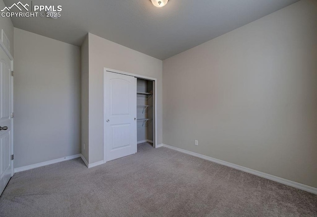 10144 Bluffstone Ct, Peyton, CO 80831 - unfurnished bedroom featuring carpet flooring, baseboards, and a closet