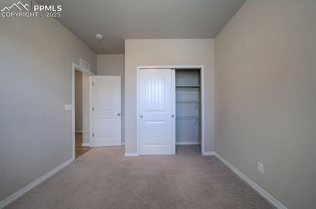 10144 Bluffstone Ct, Peyton, CO 80831 - unfurnished bedroom featuring a closet, carpet flooring, and baseboards