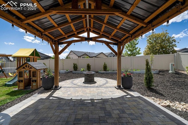 10144 Bluffstone Ct, Peyton, CO 80831 - fenced backyard featuring a gazebo, a patio, and a playground