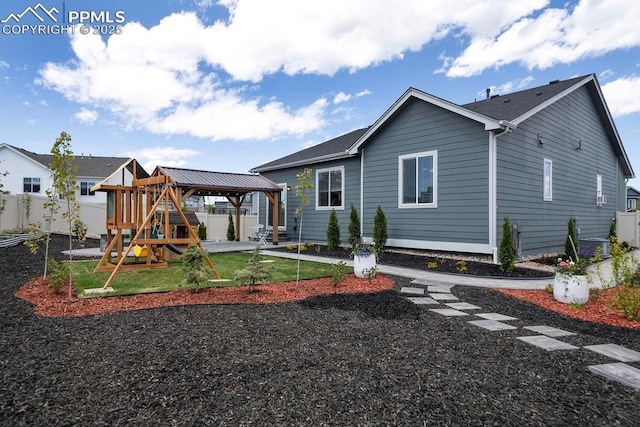 10144 Bluffstone Ct, Peyton, CO 80831 - rear view of house with a gazebo and a playground