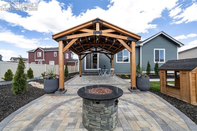 10144 Bluffstone Ct, Peyton, CO 80831 - view of patio / terrace with a fire pit and a gazebo