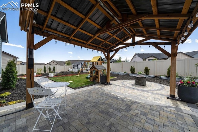 10144 Bluffstone Ct, Peyton, CO 80831 - view of patio with a playground