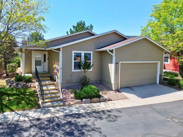 2609 Freedom Hts, Colorado Springs, CO 80904 - ranch-style house featuring a garage and driveway