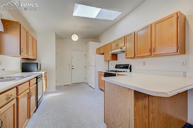 2609 Freedom Hts, Colorado Springs, CO 80904 - kitchen featuring white appliances, a skylight, under cabinet range hood, a peninsula, and light carpet
