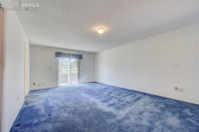 2609 Freedom Hts, Colorado Springs, CO 80904 - carpeted empty room featuring a textured ceiling and baseboards