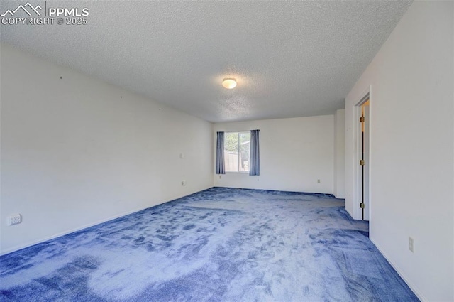 2609 Freedom Hts, Colorado Springs, CO 80904 - carpeted empty room with a textured ceiling and baseboards