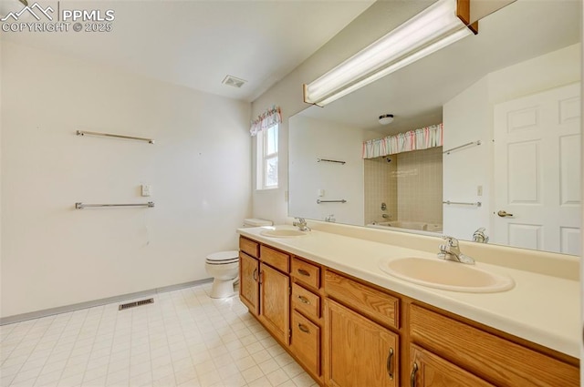 2609 Freedom Hts, Colorado Springs, CO 80904 - full bathroom with double vanity, toilet, and shower / tub combination
