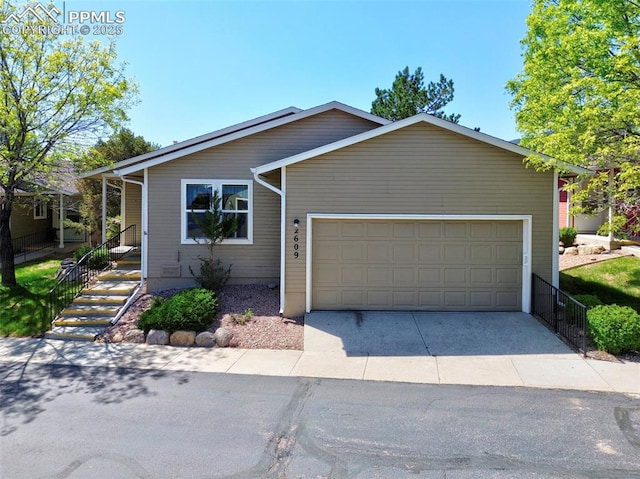 2609 Freedom Hts, Colorado Springs, CO 80904 - ranch-style house featuring a garage and driveway