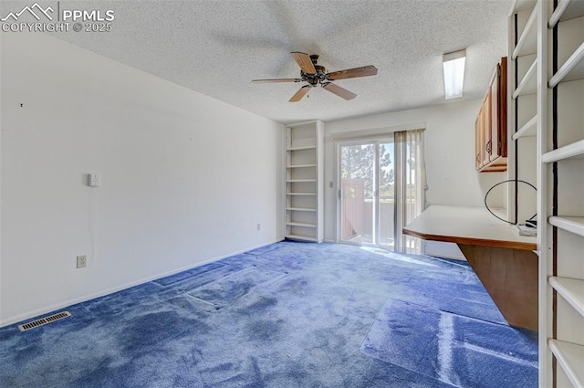 2609 Freedom Hts, Colorado Springs, CO 80904 - unfurnished room featuring a ceiling fan, a textured ceiling, and carpet floors