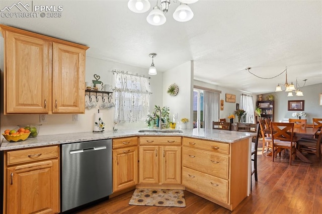 9180 S Rush Rd, Rush, CO 80833 - kitchen with stainless steel dishwasher, a chandelier, a sink, a peninsula, and dark wood-style flooring