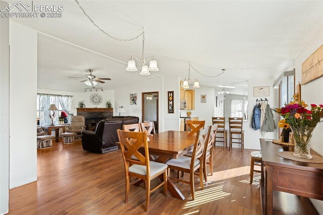 9180 S Rush Rd, Rush, CO 80833 - dining room with a chandelier, healthy amount of natural light, and wood finished floors