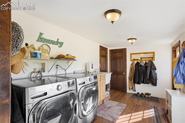 9180 S Rush Rd, Rush, CO 80833 - laundry area with separate washer and dryer and dark wood-type flooring