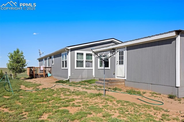 9180 S Rush Rd, Rush, CO 80833 - rear view of property with a wooden deck