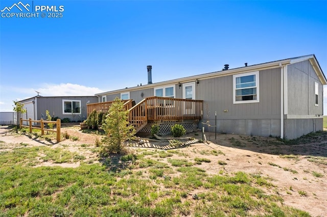 9180 S Rush Rd, Rush, CO 80833 - back of house with a wooden deck