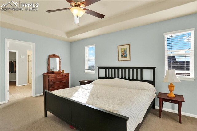 9773 Beryl Dr, Peyton, CO 80831 - bedroom with light colored carpet, baseboards, and a raised ceiling