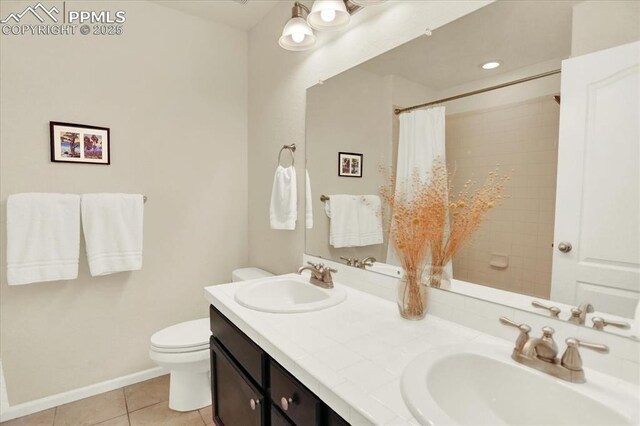 9773 Beryl Dr, Peyton, CO 80831 - full bathroom with tile patterned floors, toilet, double vanity, curtained shower, and baseboards