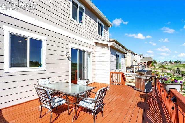 9773 Beryl Dr, Peyton, CO 80831 - wooden deck with outdoor dining area and a grill