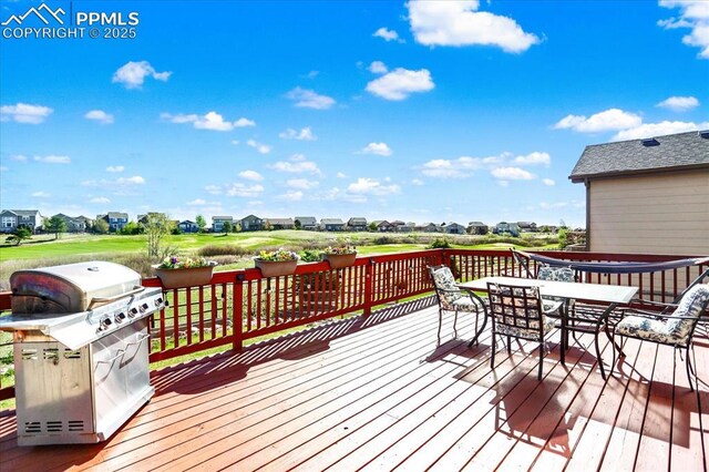9773 Beryl Dr, Peyton, CO 80831 - wooden deck featuring grilling area and outdoor dining area