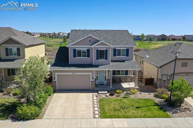 9773 Beryl Dr, Peyton, CO 80831 - view of front of house featuring covered porch, a residential view, driveway, a shingled roof, and a garage