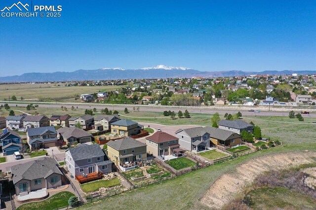 9773 Beryl Dr, Peyton, CO 80831 - aerial view of residential area with a mountain backdrop