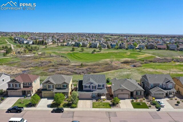 9773 Beryl Dr, Peyton, CO 80831 - aerial perspective of suburban area featuring a golf course
