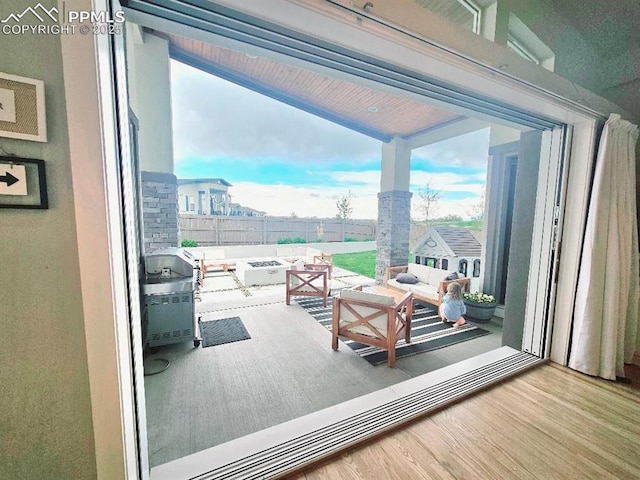 4017 Notch Trl, Colorado Springs, CO 80924 - interior space with a fenced backyard, an outdoor living space with a fire pit, and a patio