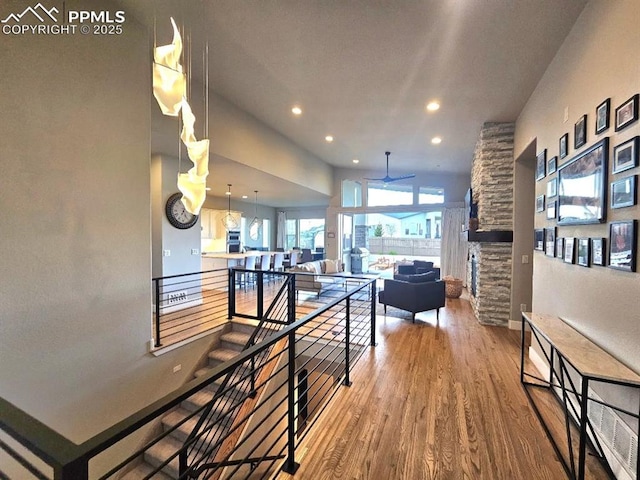 4017 Notch Trl, Colorado Springs, CO 80924 - hall featuring an upstairs landing, wood finished floors, and recessed lighting
