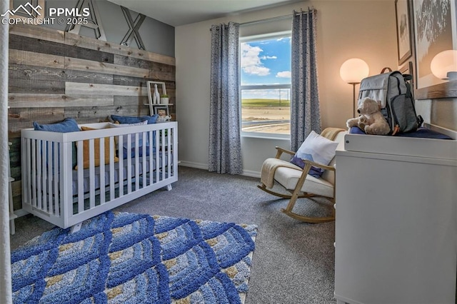 10811 Raylan Way, Falcon, CO 80831 - bedroom with carpet floors, wooden walls, and baseboards