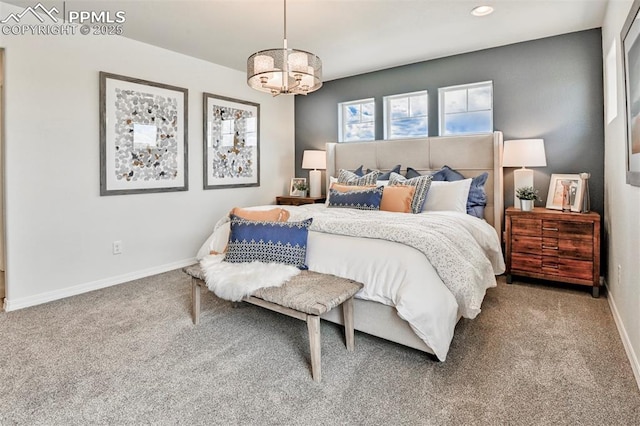 10811 Raylan Way, Falcon, CO 80831 - carpeted bedroom featuring a chandelier, baseboards, and recessed lighting