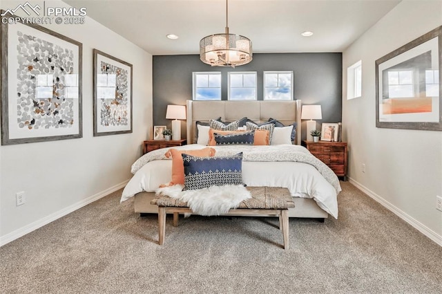10811 Raylan Way, Falcon, CO 80831 - carpeted bedroom with a chandelier, baseboards, and recessed lighting