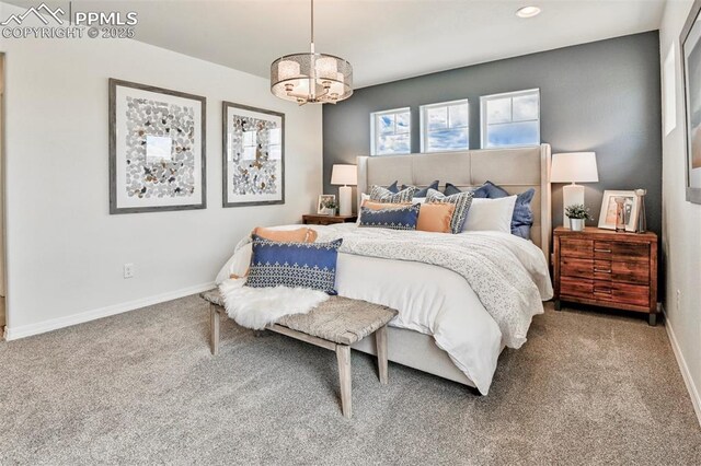 10811 Raylan Way, Falcon, CO 80831 - carpeted bedroom with a chandelier, baseboards, and recessed lighting