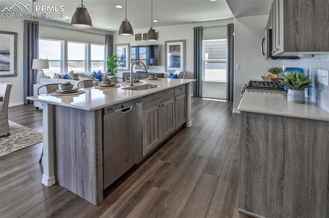 10811 Raylan Way, Falcon, CO 80831 - kitchen featuring appliances with stainless steel finishes, a sink, light countertops, healthy amount of natural light, and recessed lighting