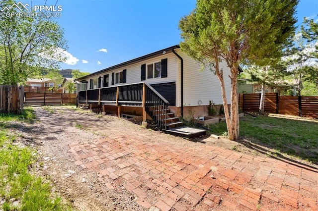 1210 Westend Ave, Colorado Springs, CO 80904 - rear view of property with a patio and a deck