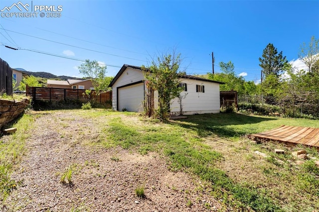 1210 Westend Ave, Colorado Springs, CO 80904 - view of yard featuring a garage and an outbuilding
