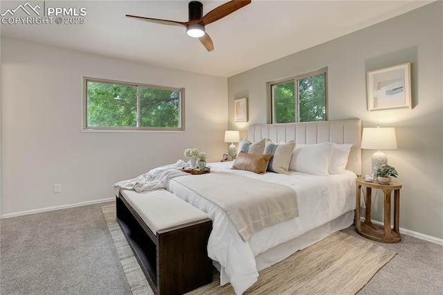 5208 Pinon Valley Rd, Colorado Springs, CO 80919 - carpeted bedroom featuring multiple windows, baseboards, and ceiling fan