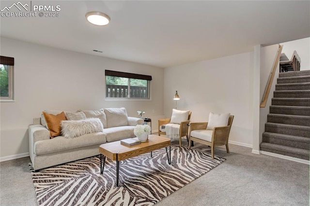 5208 Pinon Valley Rd, Colorado Springs, CO 80919 - carpeted living room featuring stairs and baseboards