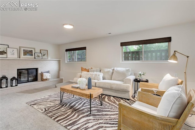 5208 Pinon Valley Rd, Colorado Springs, CO 80919 - living area featuring healthy amount of natural light, carpet, and a brick fireplace