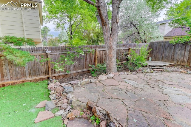 5208 Pinon Valley Rd, Colorado Springs, CO 80919 - fenced backyard featuring a patio area