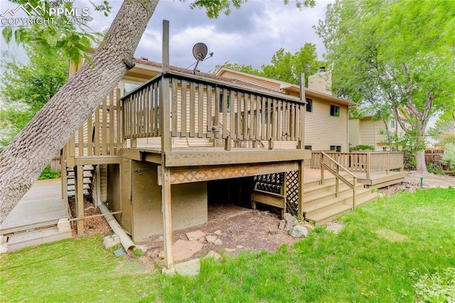 5208 Pinon Valley Rd, Colorado Springs, CO 80919 - rear view of property featuring stairs, a deck, a chimney, and a yard