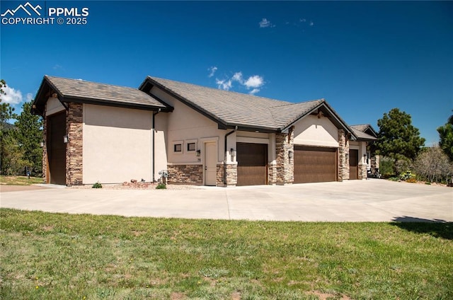 797 Forest View Way, Monument, CO 80132 - view of front of property with stone siding, an attached garage, and stucco siding