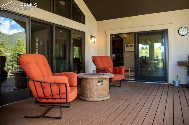 797 Forest View Way, Monument, CO 80132 - wooden deck with an outdoor fire pit