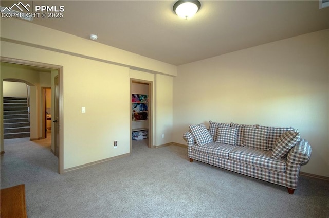 797 Forest View Way, Monument, CO 80132 - living room with arched walkways, carpet flooring, baseboards, and stairs