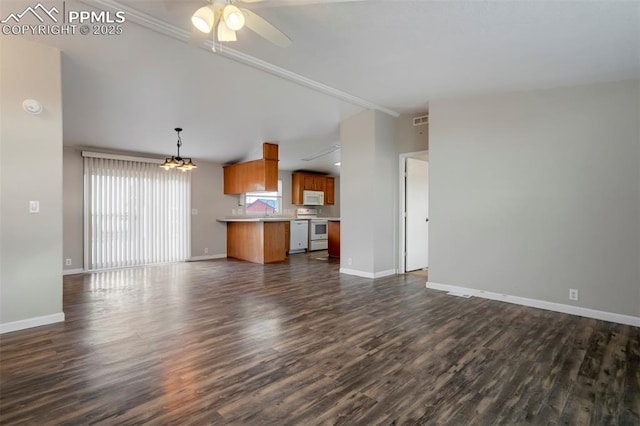 20150 Enoch Rd, Colorado Springs, CO 80930 - unfurnished living room featuring dark wood finished floors, baseboards, a ceiling fan, a sink, and lofted ceiling