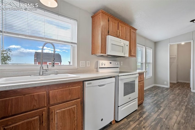 20150 Enoch Rd, Colorado Springs, CO 80930 - kitchen featuring white appliances, a sink, light countertops, brown cabinets, and dark wood finished floors