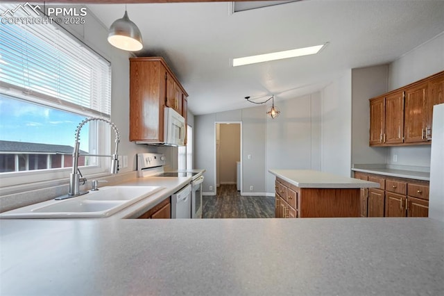 20150 Enoch Rd, Colorado Springs, CO 80930 - kitchen featuring a sink, white appliances, lofted ceiling, brown cabinetry, and light countertops