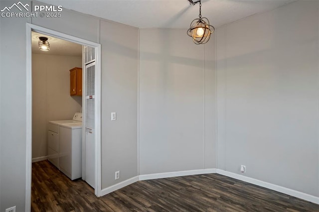 20150 Enoch Rd, Colorado Springs, CO 80930 - washroom with cabinet space, dark wood-type flooring, washing machine and dryer, and baseboards