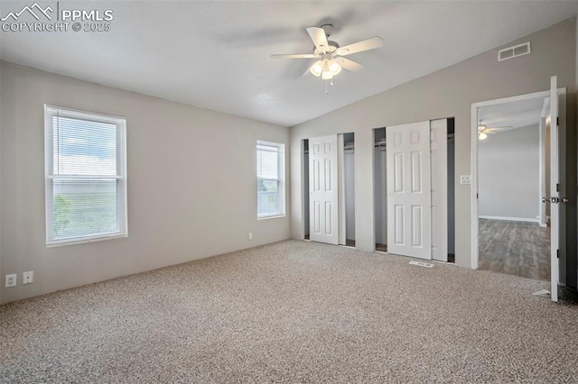 20150 Enoch Rd, Colorado Springs, CO 80930 - unfurnished bedroom featuring multiple closets, carpet, lofted ceiling, and a ceiling fan