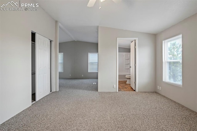 20150 Enoch Rd, Colorado Springs, CO 80930 - unfurnished bedroom featuring carpet floors, vaulted ceiling, ensuite bathroom, a closet, and a ceiling fan