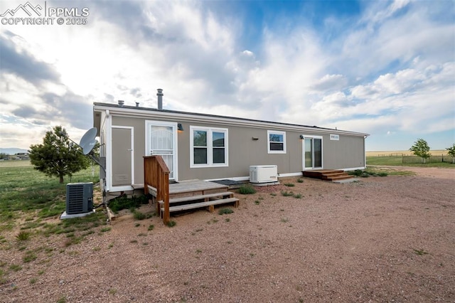 20150 Enoch Rd, Colorado Springs, CO 80930 - rear view of house with central air condition unit and a wooden deck